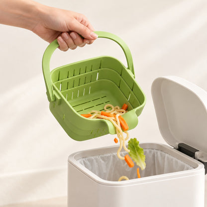 Tipping scraps from the basket into the trash